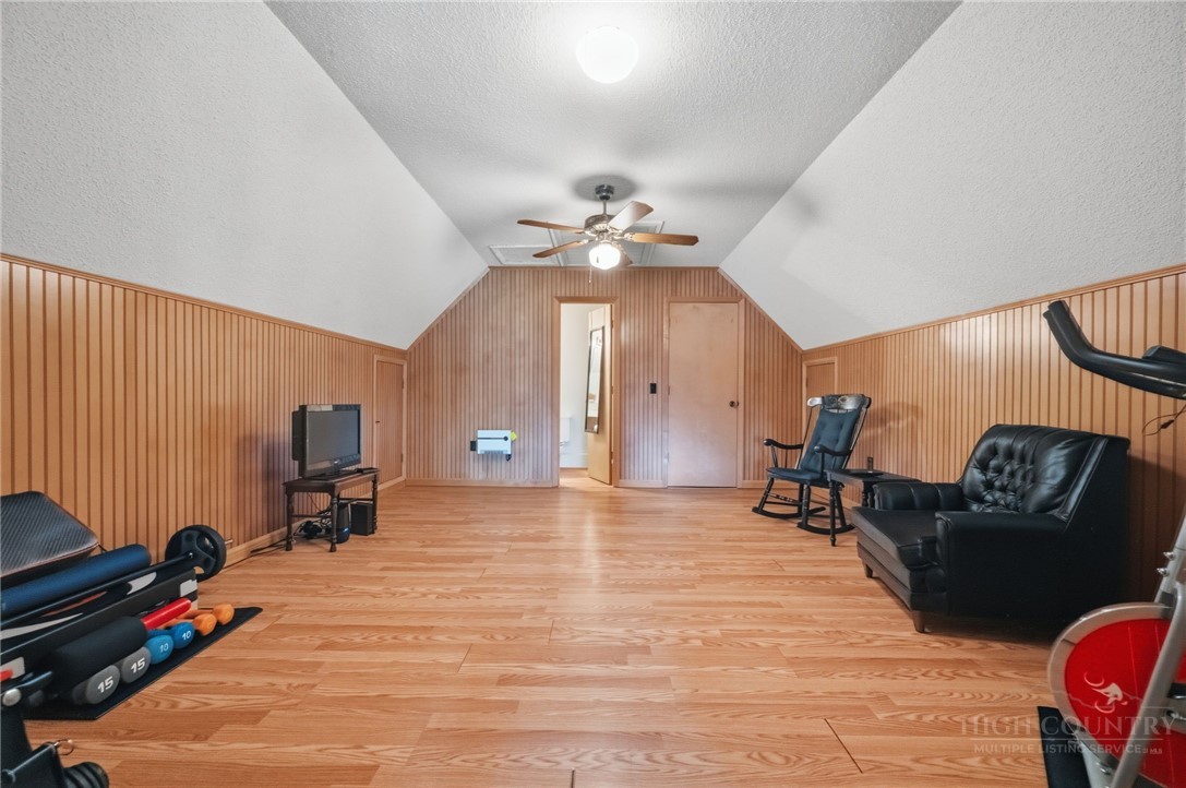 83 Pine Ridge Loop Newland, NC 28657 - Photo 18 of 32 a view of a livingroom with furniture and a flat screen tv