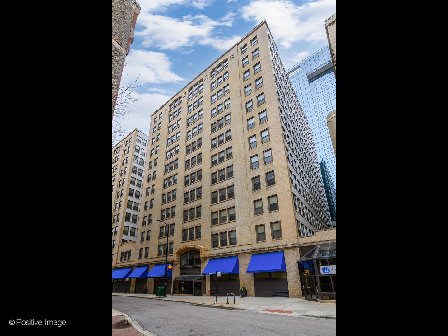 740 South Federal Street, Unit 301 Chicago, IL 60605 - Photo 1 of 10 a view of a tall building sitting on the side of a street