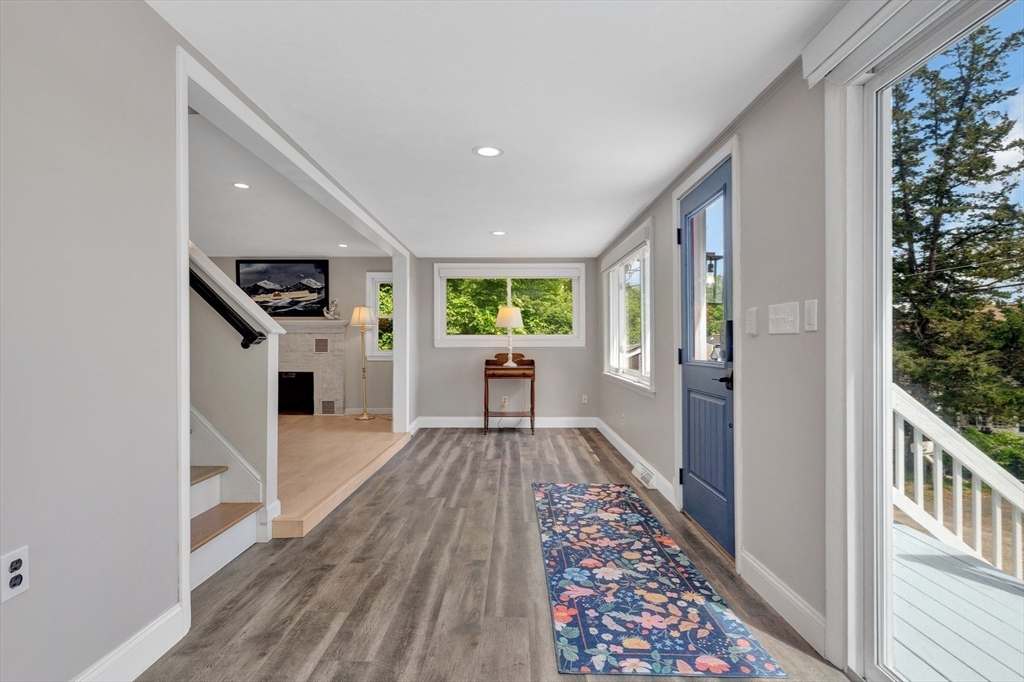 118 Woolford Road Wrentham, MA 02093 - Photo 7 of 41 a view of a hallway with wooden floor and staircase