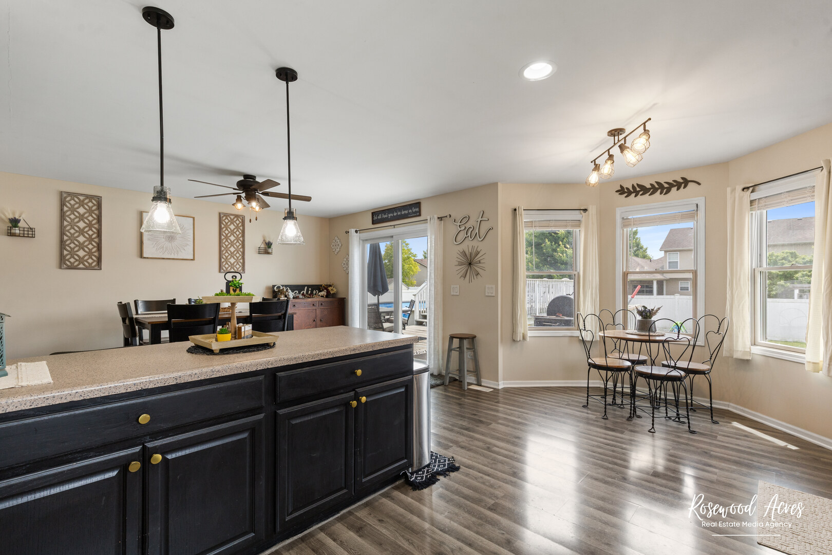 840 Peony Lane Bourbonnais, IL 60914 - Photo 11 of 30 a view of a dining room and livingroom with furniture wooden floor a chandelier