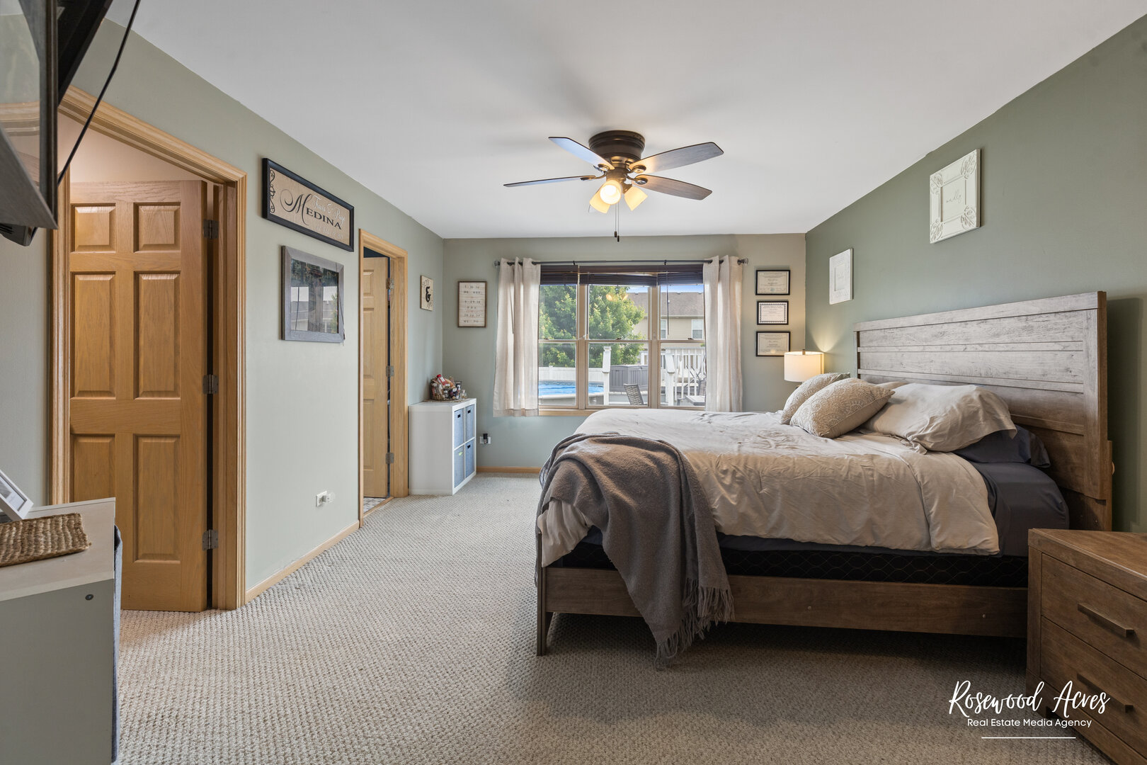840 Peony Lane Bourbonnais, IL 60914 - Photo 17 of 30 a spacious bedroom with a bed and a chandelier