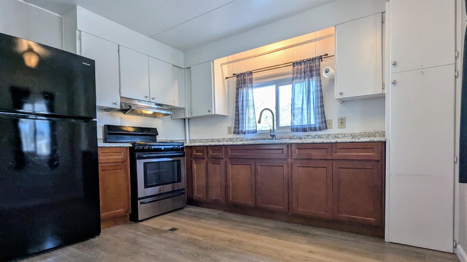 234 Palm View Lane Rancho Cordova, CA 95670 - Photo 1 of 1 a kitchen with stainless steel appliances granite countertop a refrigerator and a sink