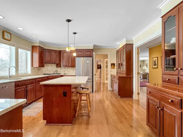 a spacious bedroom with two beds and a chair