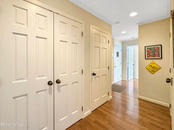 a view of a room with wooden floor