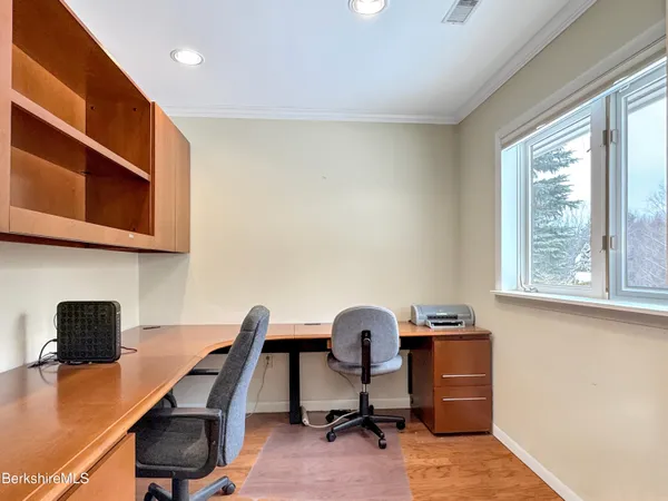 a view of house with backyard and garden