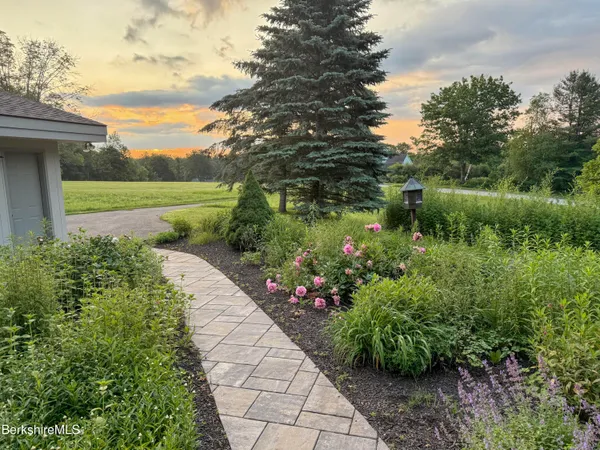 a living room with furniture rug and window