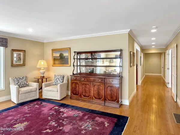 a view of a dining room with furniture and chandelier