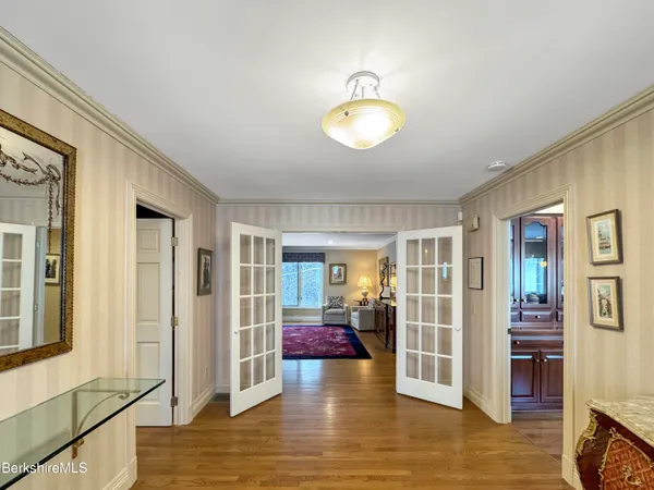 a kitchen with stainless steel appliances granite countertop wooden floors and sink