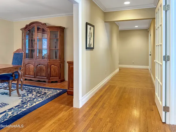a living room with furniture and a book shelf