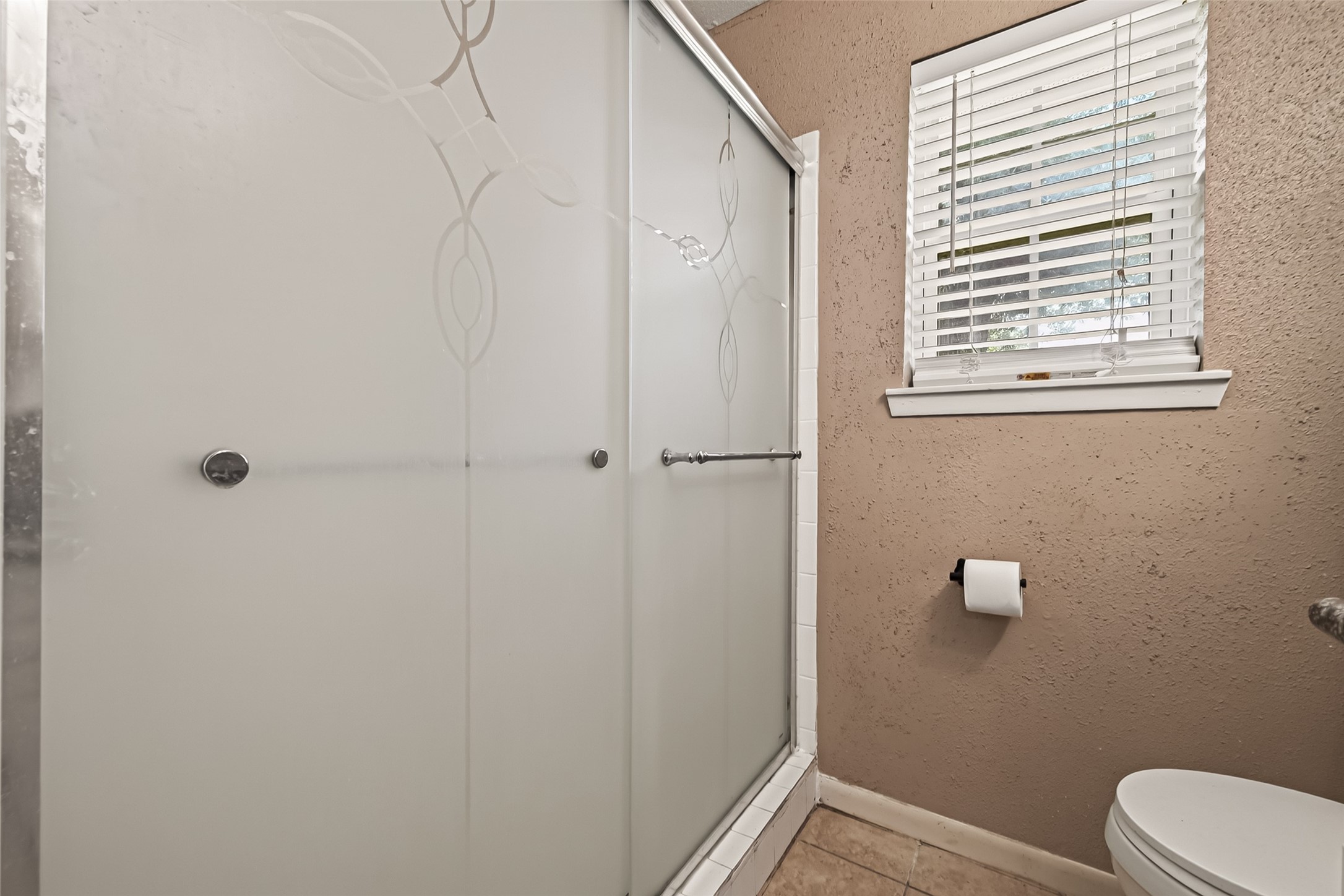 719 Kilpatrick Street Channelview, TX 77530 - Photo 17 of 40 This bathroom includes a spacious stand-alone shower enhanced with privacy film