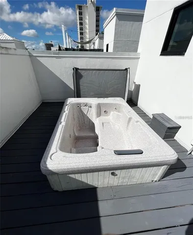 a view of roof deck with patio