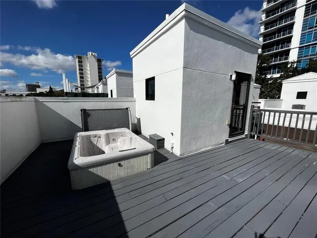 a view of a terrace with wooden floor and fence