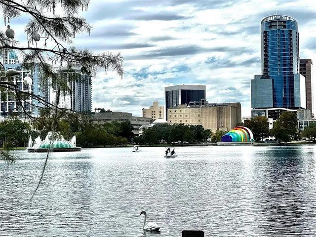 a city street lined with buildings and cars