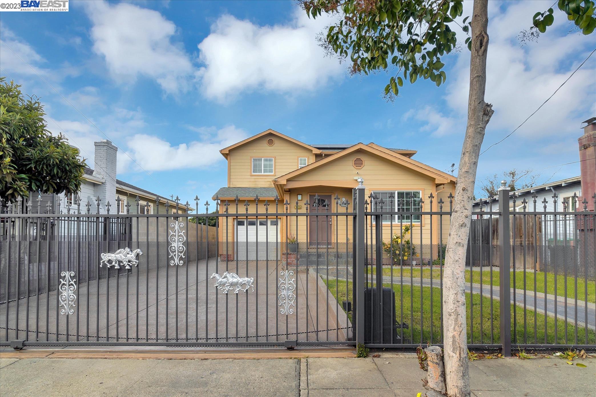 a view of a house with a iron gate