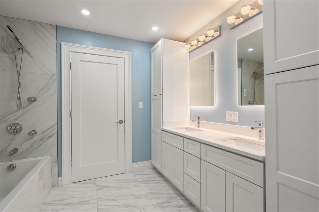 10 Hitching Post Lane Weston, MA 02493 - Photo 32 of 42 a bathroom with a granite countertop sink mirror and a bathtub