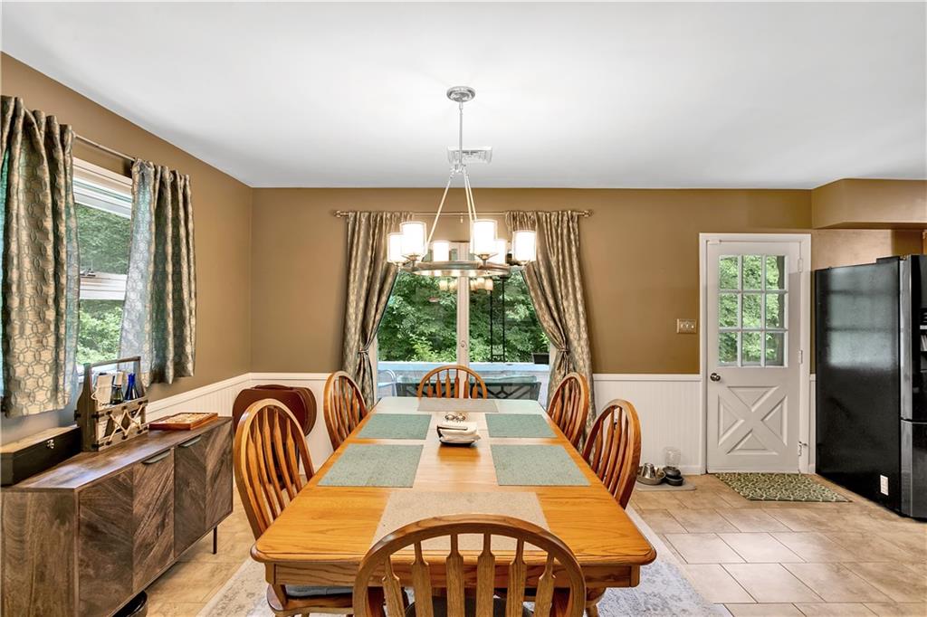 200 Evans City Road Freedom, PA 15042 - Photo 11 of 37 a view of a dining room with furniture window and outside view