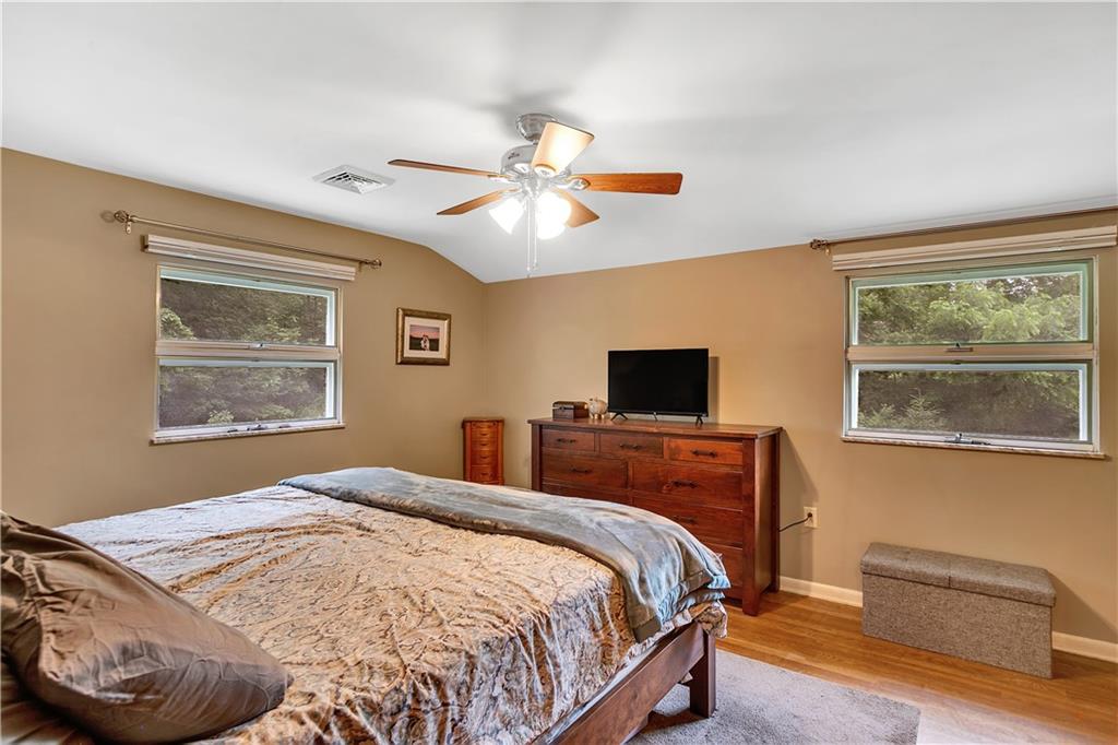200 Evans City Road Freedom, PA 15042 - Photo 20 of 37 a bedroom with a bed and a window
