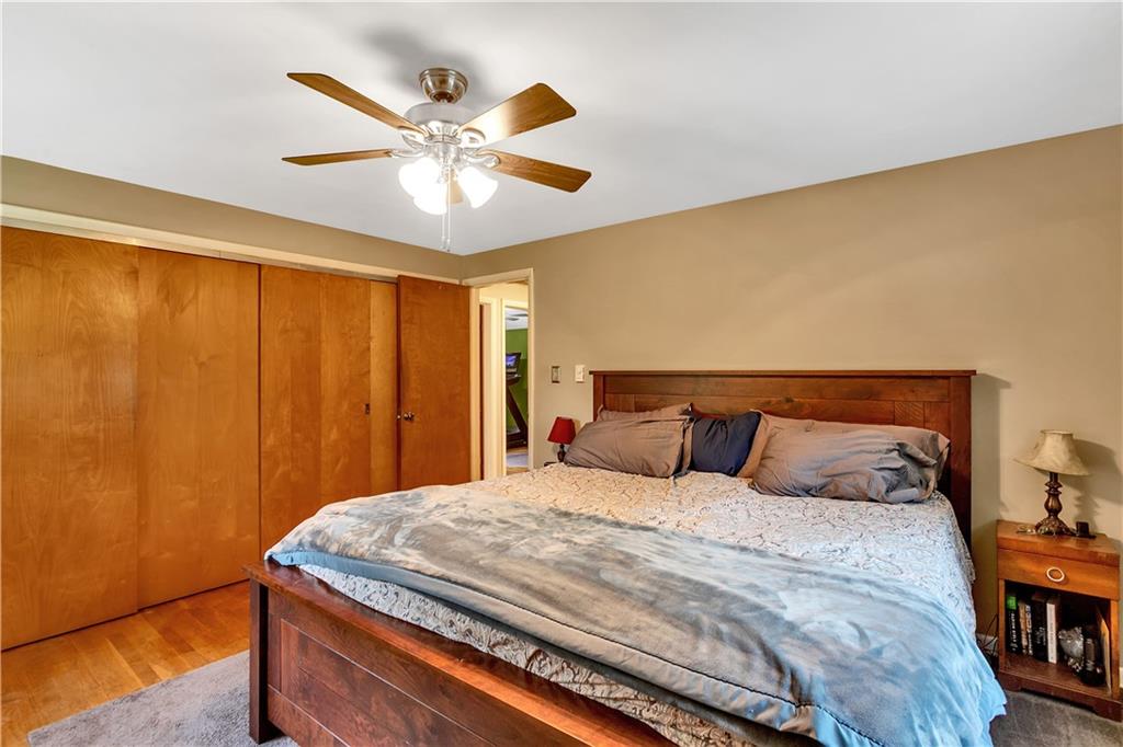 200 Evans City Road Freedom, PA 15042 - Photo 21 of 37 a bedroom with a bed and a chandelier