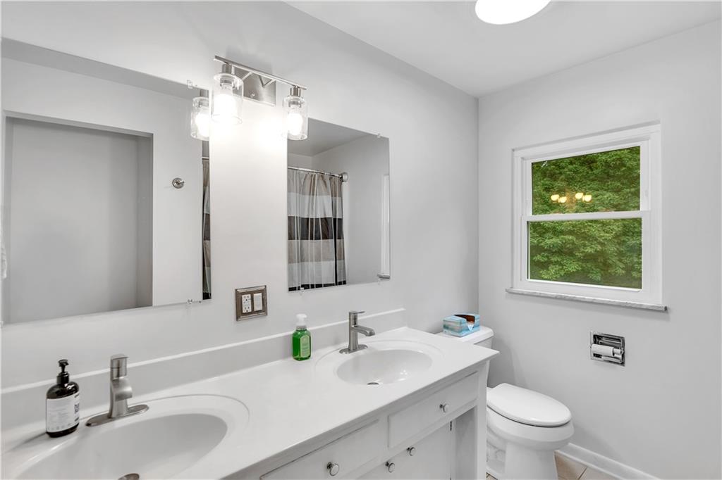 200 Evans City Road Freedom, PA 15042 - Photo 24 of 37 a bathroom with a sink and a mirror