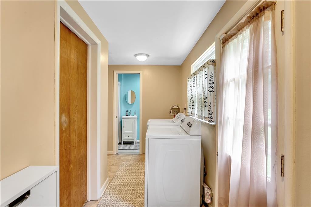200 Evans City Road Freedom, PA 15042 - Photo 29 of 37 a bathroom with a sink a mirror and a bathtub