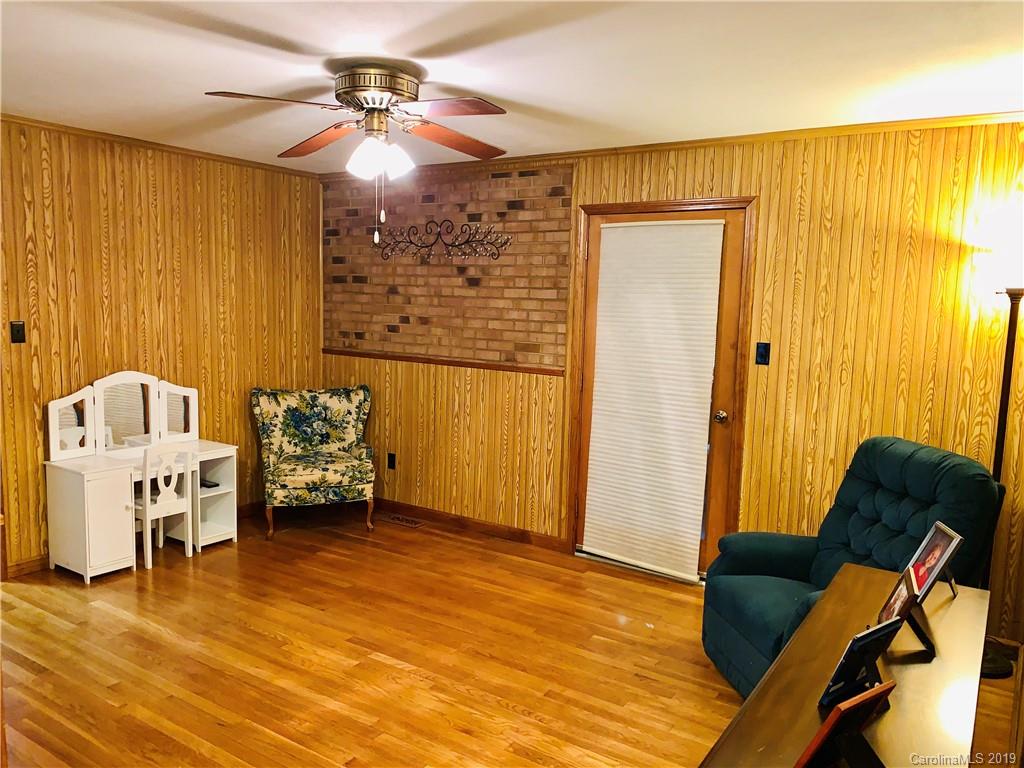 220 Pine Valley Road Salisbury, NC 28147 - Photo 14 of 29 a living room with furniture and a chandelier