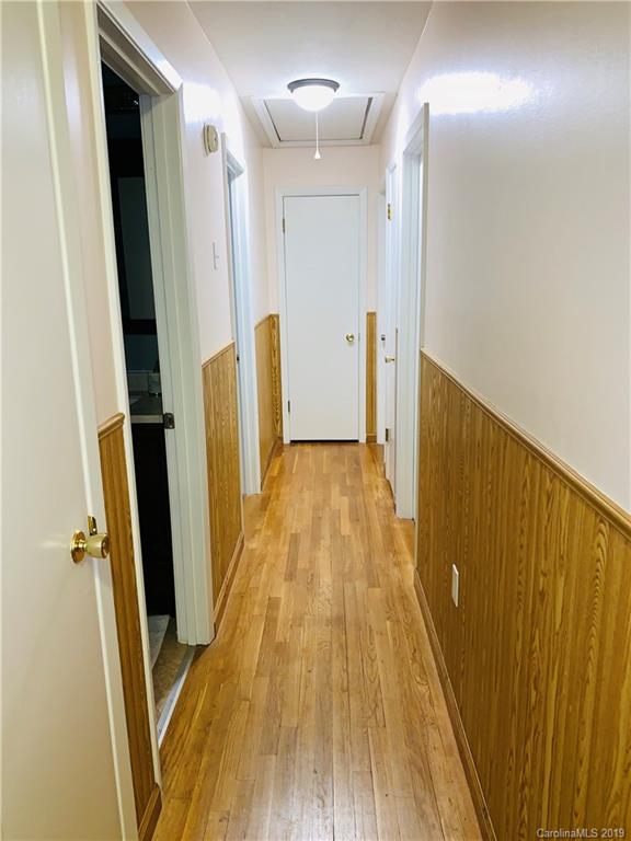 220 Pine Valley Road Salisbury, NC 28147 - Photo 17 of 29 a view of a hallway with wooden floor and staircase
