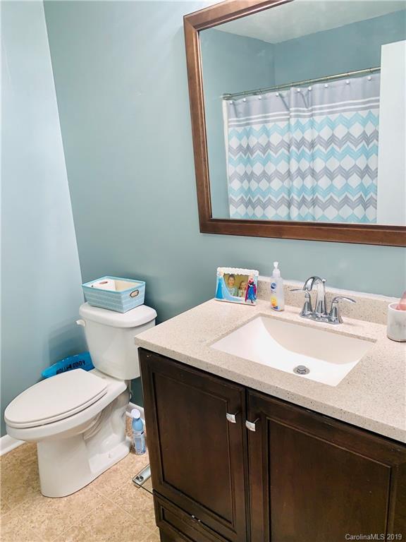 220 Pine Valley Road Salisbury, NC 28147 - Photo 18 of 29 a bathroom with a granite countertop sink mirror vanity and toilet