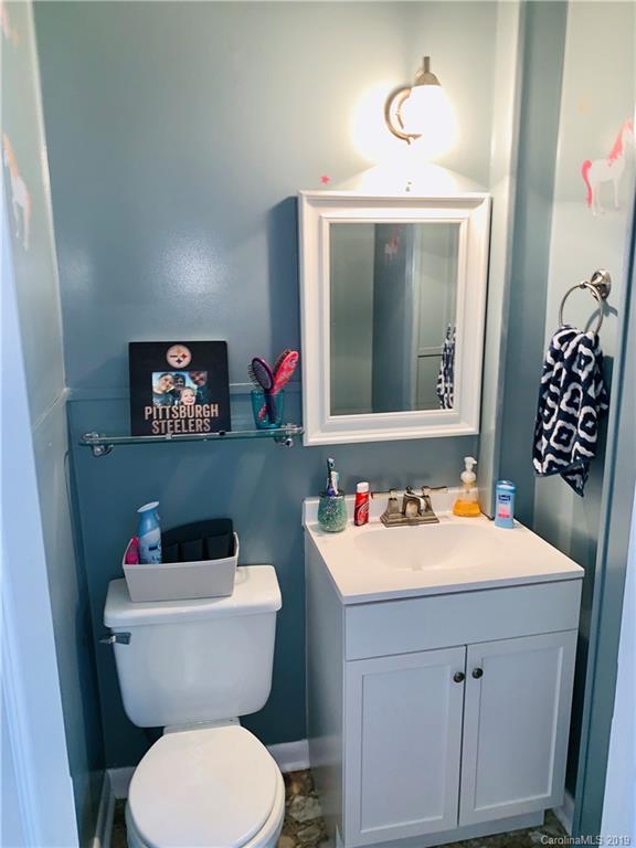 220 Pine Valley Road Salisbury, NC 28147 - Photo 21 of 29 a bathroom with a toilet sink and mirror