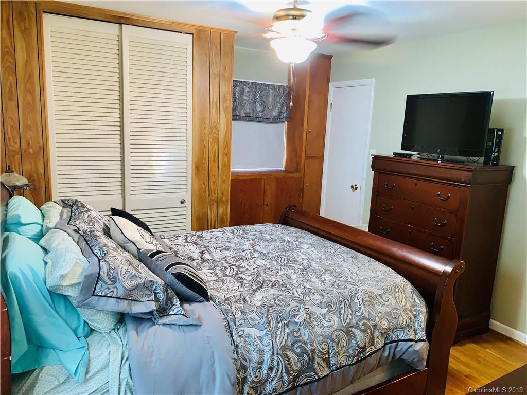 220 Pine Valley Road Salisbury, NC 28147 - Photo 23 of 29 a bedroom with a bed and a flat screen tv