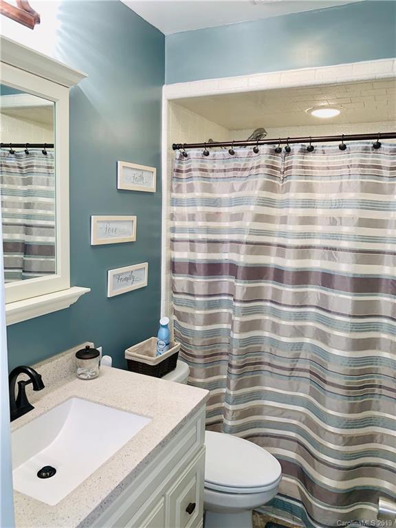 220 Pine Valley Road Salisbury, NC 28147 - Photo 24 of 29 a bathroom with a sink a toilet and shower curtain