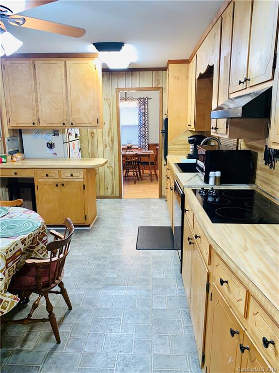 220 Pine Valley Road Salisbury, NC 28147 - Photo 7 of 29 a kitchen with sink cabinets and dining table