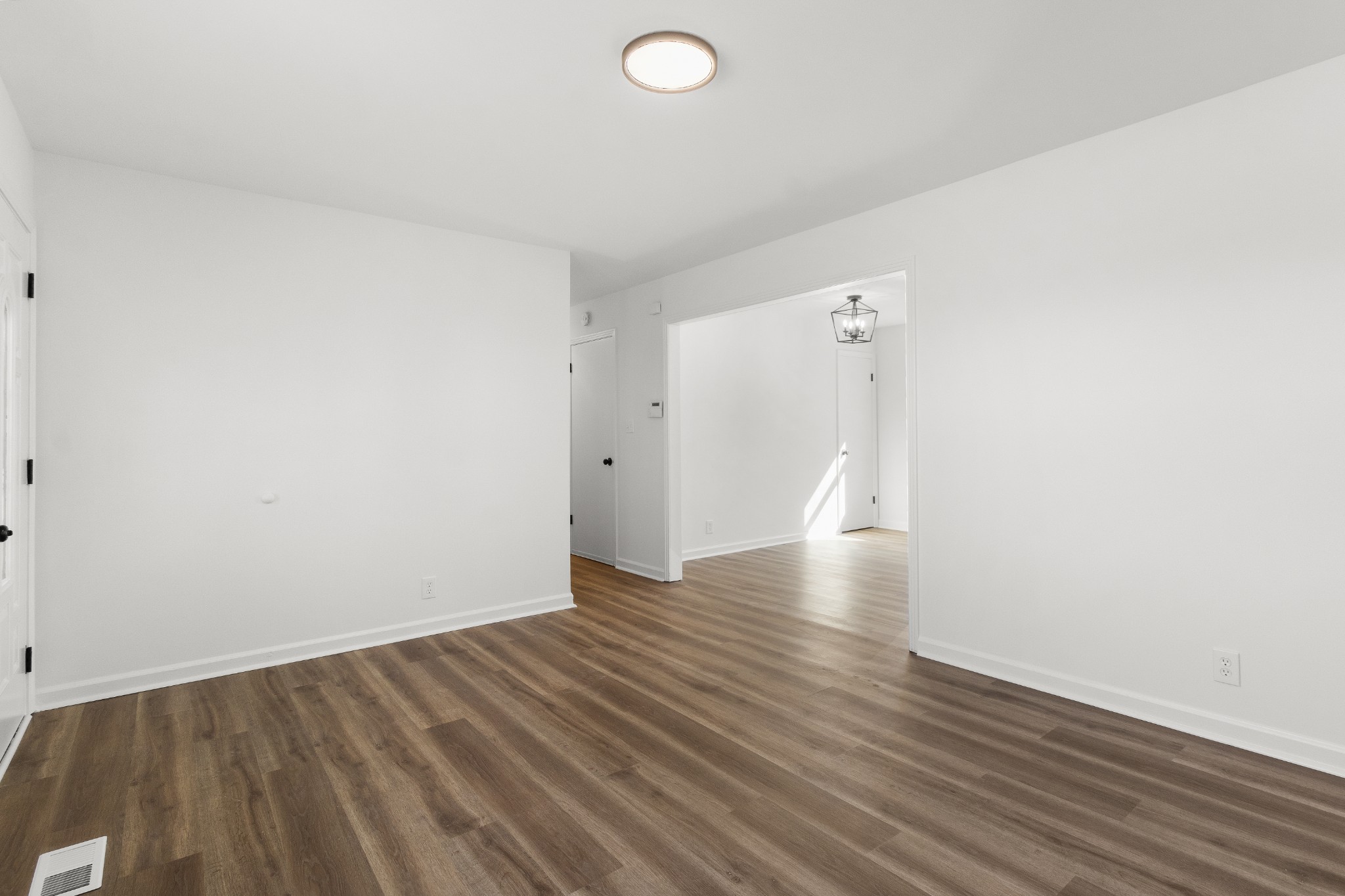 1402 Southside Road Southside, TN 37171 - Photo 7 of 24 a view of room with wooden floor and white walls
