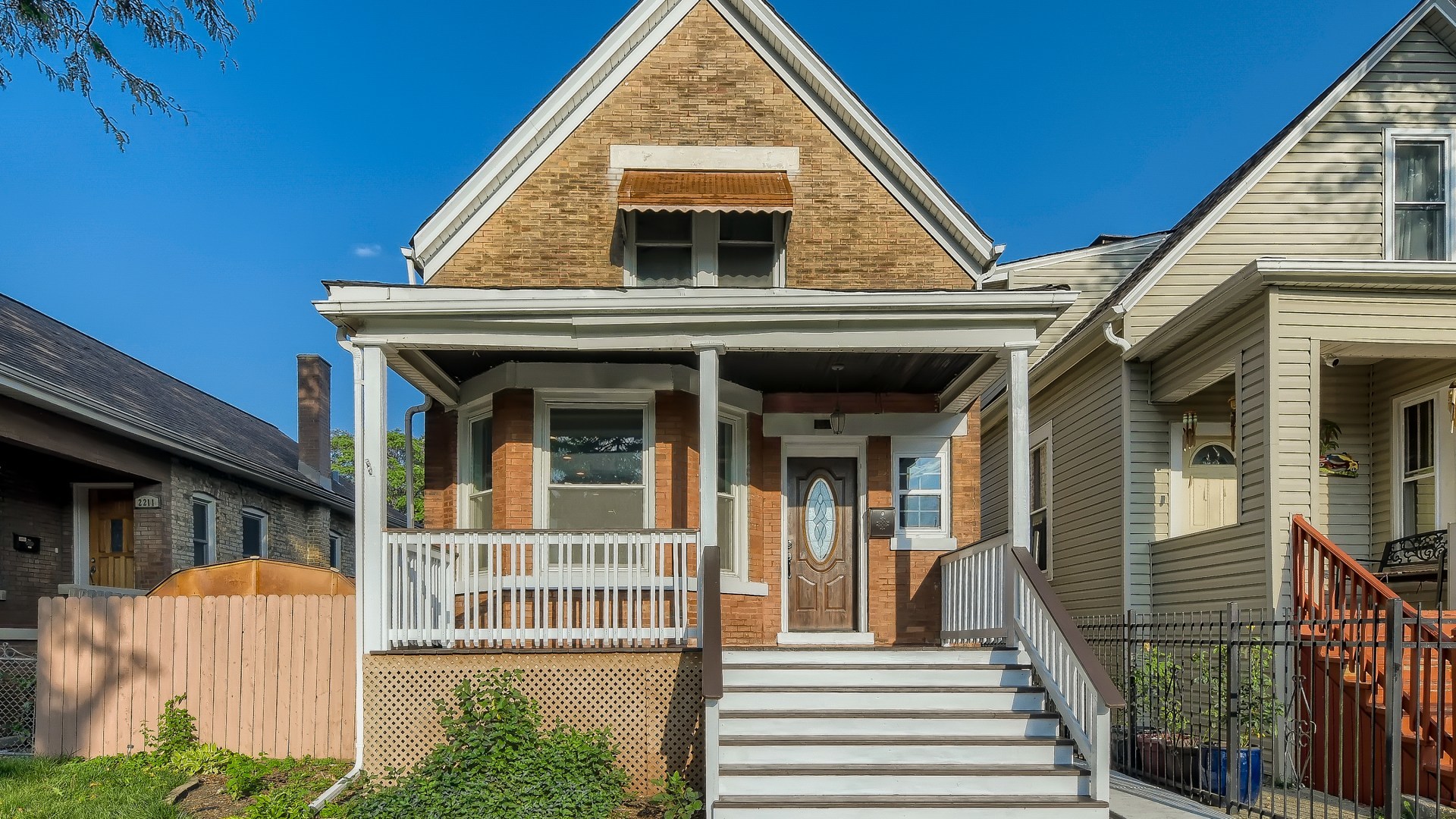 2209 North Kilpatrick Avenue Chicago, IL 60639 - Photo 1 of 22 a view of a house with entrance and stairs