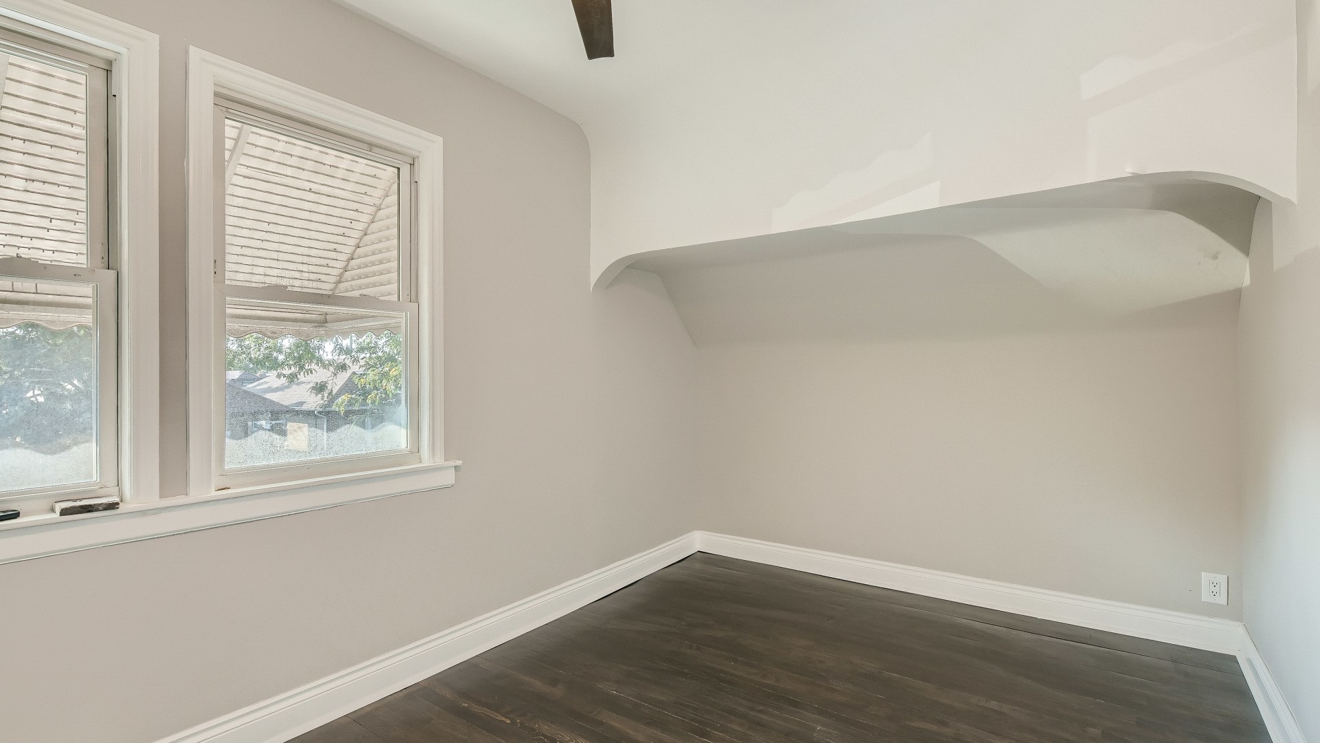 2209 North Kilpatrick Avenue Chicago, IL 60639 - Photo 13 of 22 an empty room with wooden floor and windows