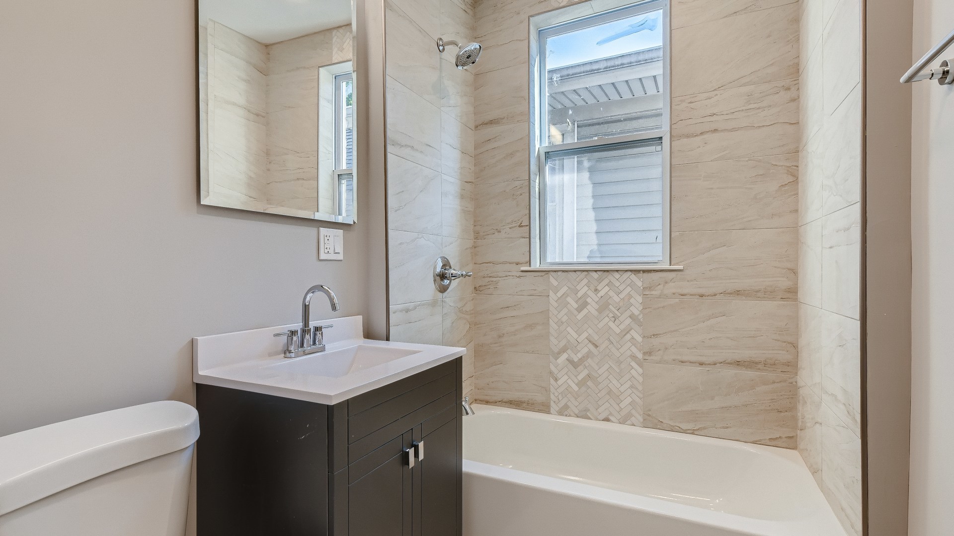 2209 North Kilpatrick Avenue Chicago, IL 60639 - Photo 15 of 22 a bathroom with a sink a toilet and a bathtub