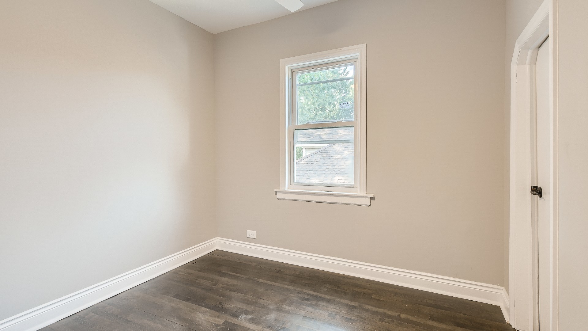 2209 North Kilpatrick Avenue Chicago, IL 60639 - Photo 18 of 22 an empty room with wooden floor and windows