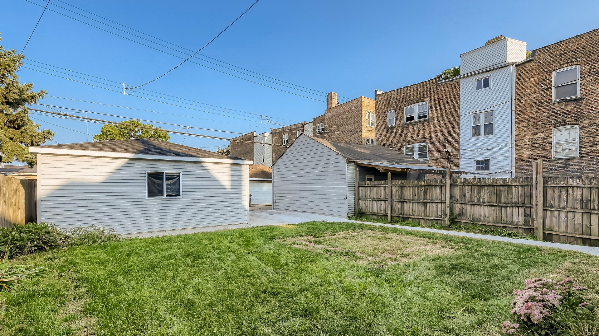 2209 North Kilpatrick Avenue Chicago, IL 60639 - Photo 22 of 22 a front view of a house with a yard