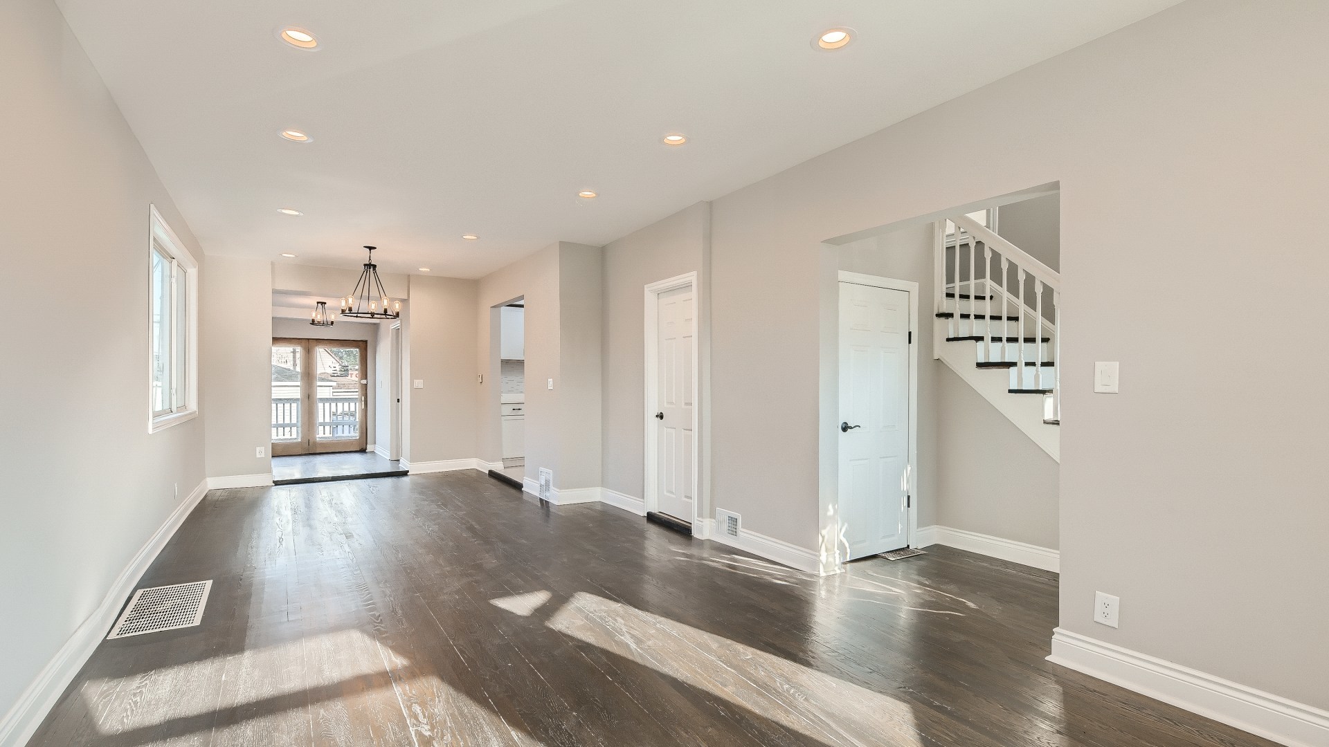 2209 North Kilpatrick Avenue Chicago, IL 60639 - Photo 5 of 22 an empty room with wooden floor and windows