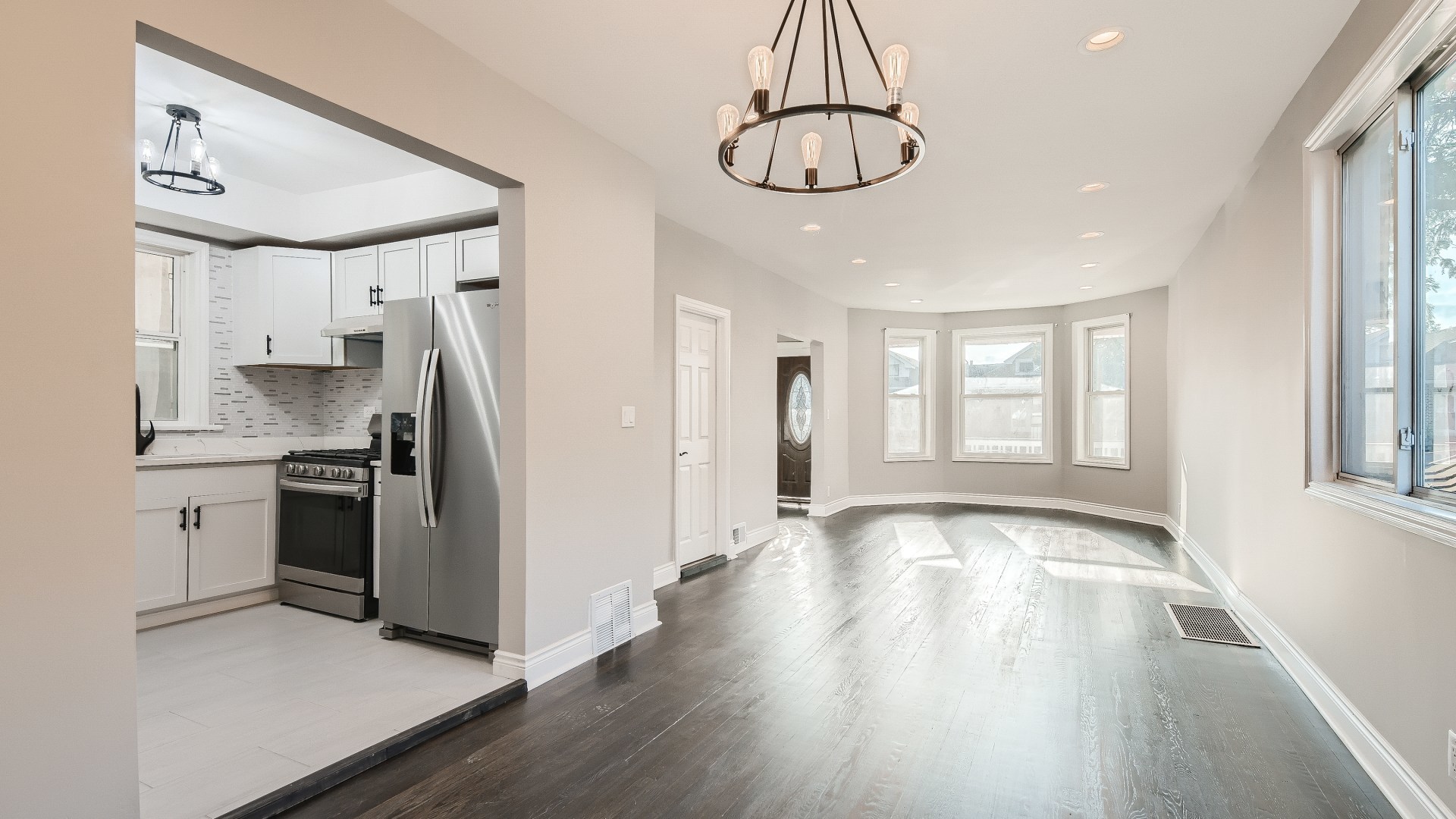 2209 North Kilpatrick Avenue Chicago, IL 60639 - Photo 7 of 22 a view of a kitchen with a sink a refrigerator and wooden floor