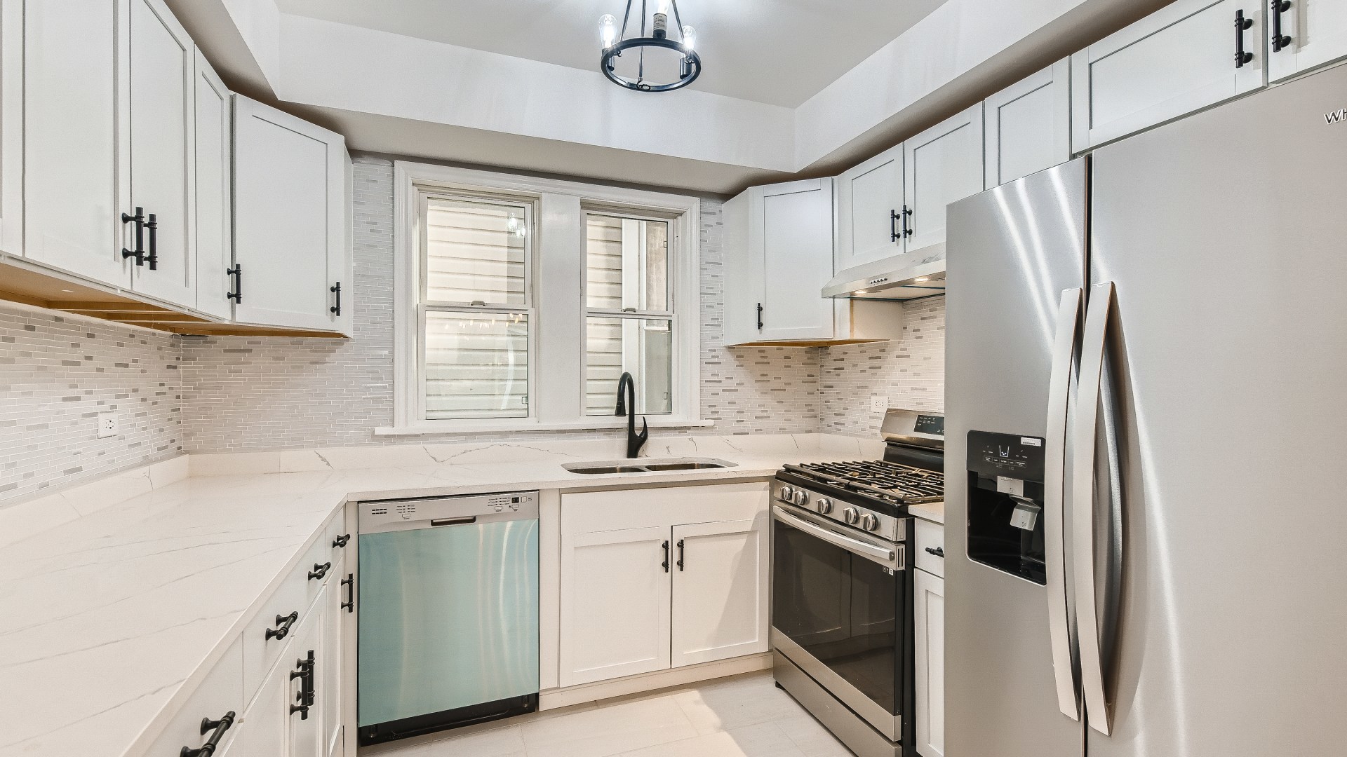 2209 North Kilpatrick Avenue Chicago, IL 60639 - Photo 8 of 22 a kitchen with white cabinets and white appliances