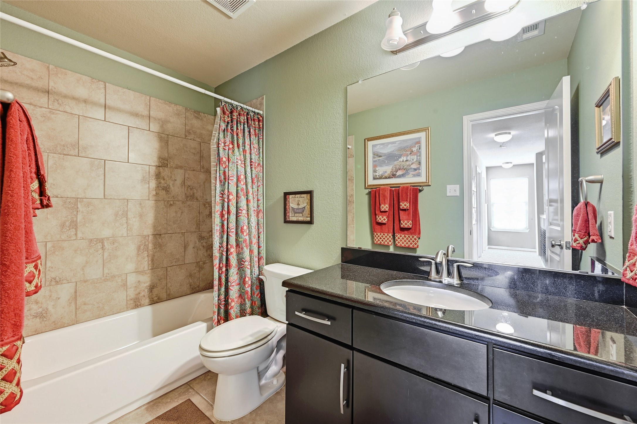 11317 Lost Maples Trail Austin, TX 78748 - Photo 22 of 26 a bathroom with a sink a toilet and shower