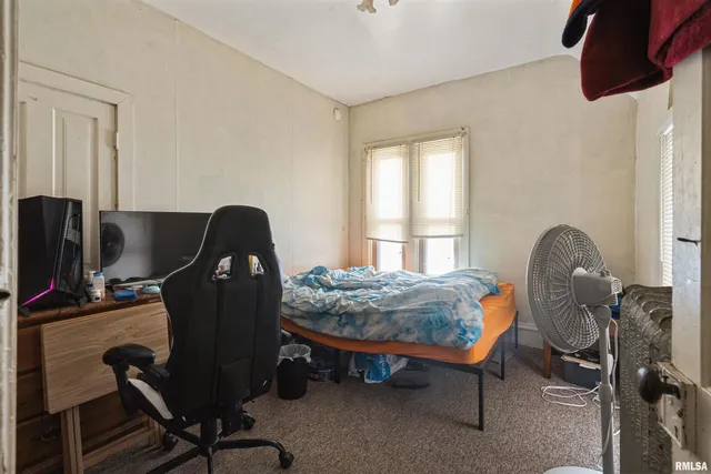 a workspace with furniture and a window