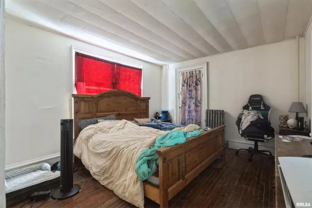 a bed room with a bed and a tv