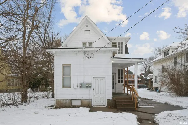 a view of a house with a snow