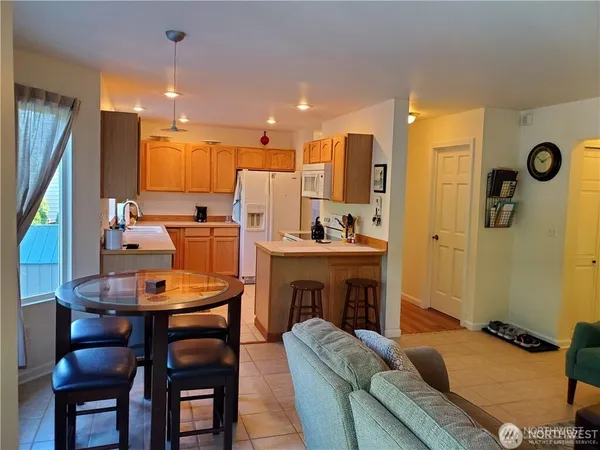 a dining room with furniture and a fireplace