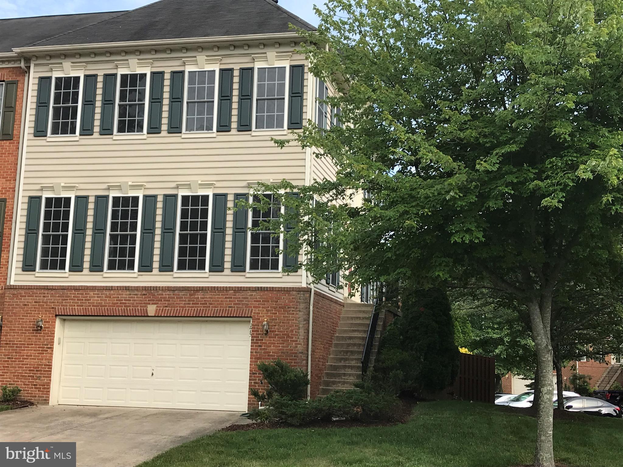 Stately End Unit Townhome with 2 Car Garage