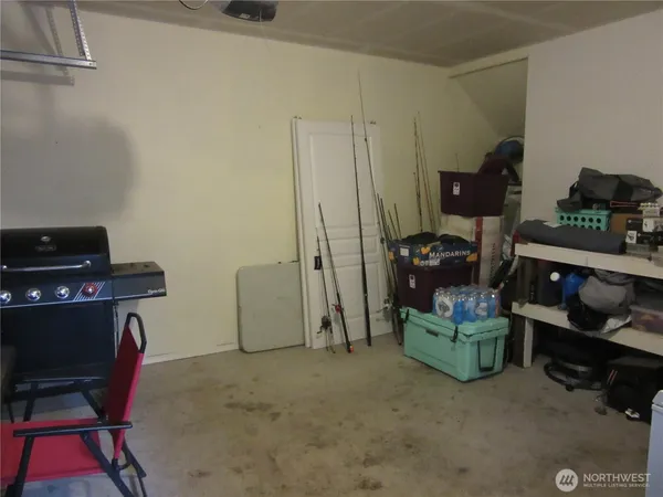 a room with furniture and a lamp