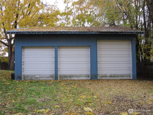 a wooden door in front of a house