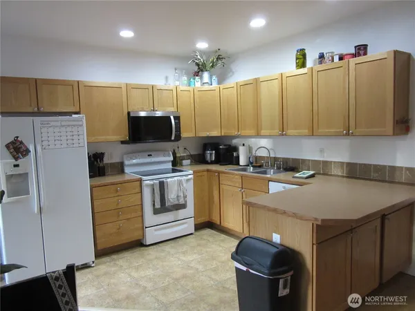 a kitchen with cabinets a sink and a stove