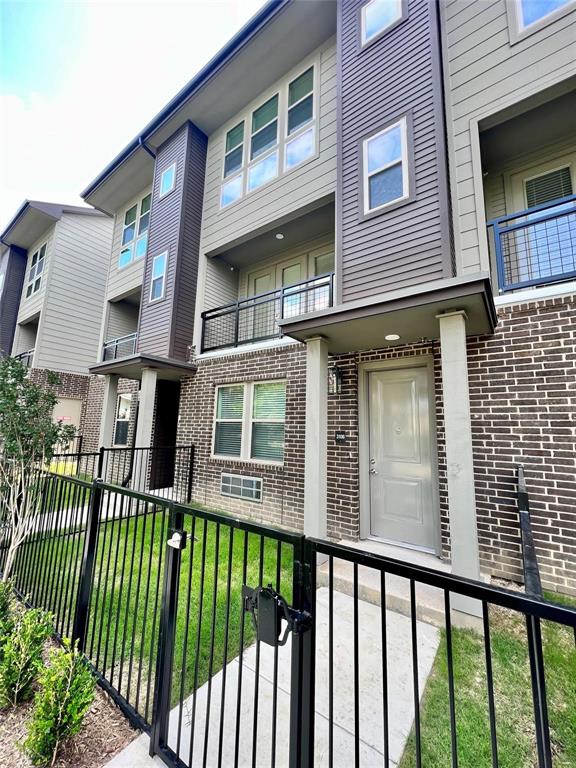 4020 McEwen Road, Unit 3103 Farmers Branch, TX 75244 - Photo 2 of 27 a view of a brick building from a balcony
